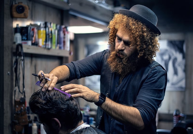 Barber styling hair